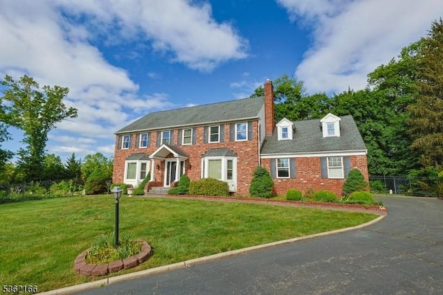 1 Willow Brook Ln, Clinton Twp, NJ 08801 - colonial house with a chimney and brick siding