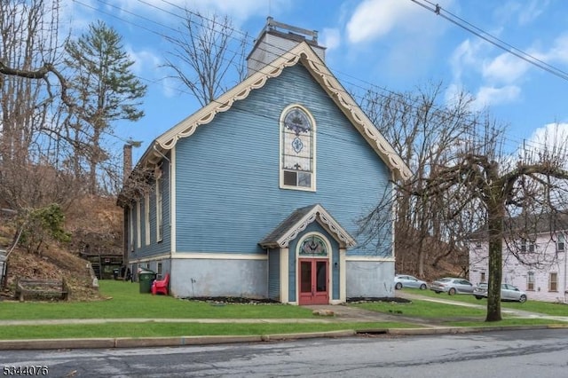 192 Market St, Belvidere Twp, NJ 07823 - victorian-style house featuring a chimney, french doors, and a front lawn