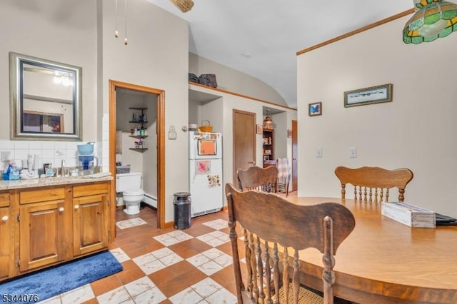 192 Market St, Belvidere Twp, NJ 07823 - dining room featuring lofted ceiling, baseboards, and a baseboard heating unit