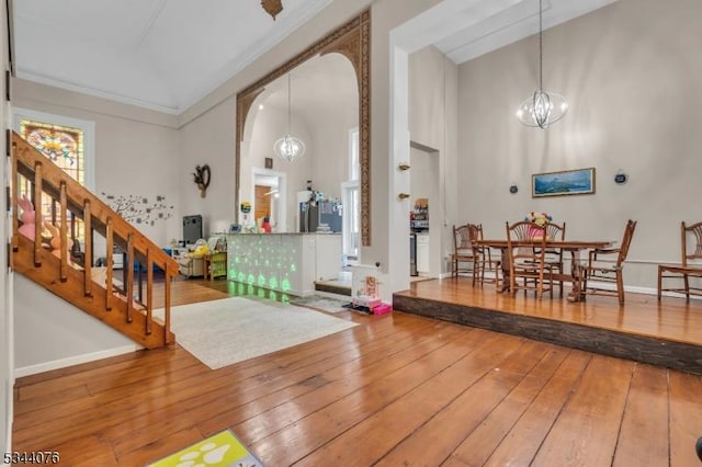 192 Market St, Belvidere Twp, NJ 07823 - entryway with a high ceiling, wood-type flooring, a chandelier, arched walkways, and stairway