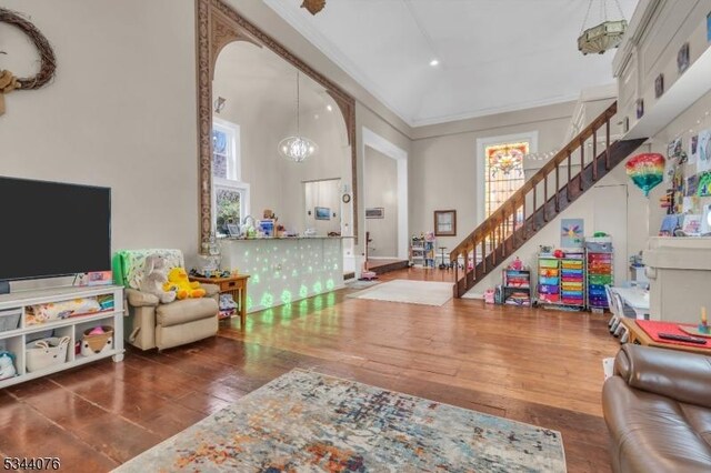 192 Market St, Belvidere Twp, NJ 07823 - living area with stairway, hardwood / wood-style floors, a chandelier, arched walkways, and recessed lighting