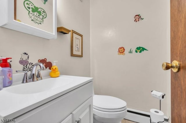 192 Market St, Belvidere Twp, NJ 07823 - half bathroom with a baseboard heating unit, vanity, and toilet