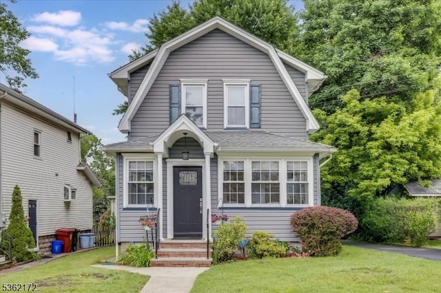 136 Pershing Ave, Nutley Twp, NJ 07110 - dutch colonial featuring a front yard and a gambrel roof