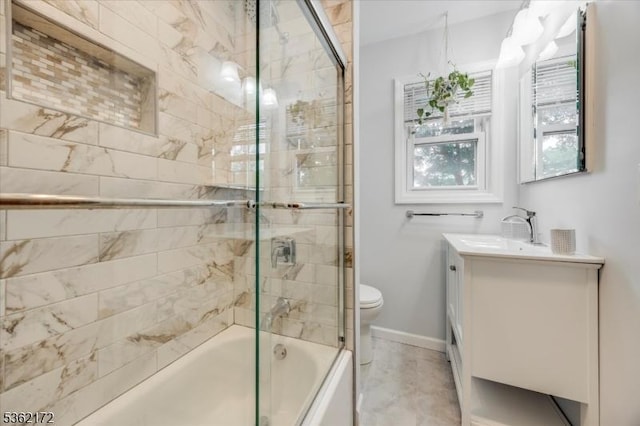136 Pershing Ave, Nutley Twp, NJ 07110 - bathroom featuring toilet, vanity, bath / shower combo with glass door, and baseboards