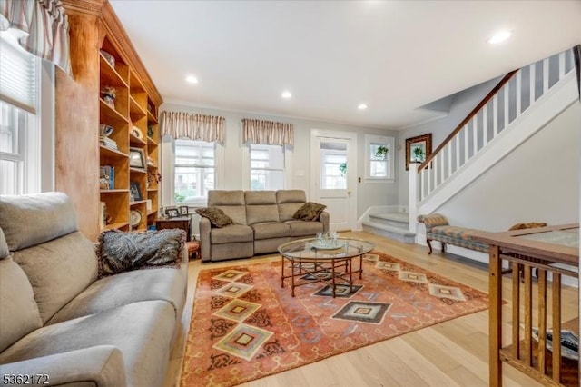136 Pershing Ave, Nutley Twp, NJ 07110 - living room with light wood finished floors, plenty of natural light, stairway, recessed lighting, and ornamental molding
