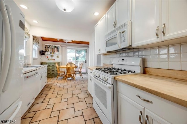 136 Pershing Ave, Nutley Twp, NJ 07110 - kitchen featuring white appliances, white cabinets, decorative backsplash, recessed lighting, and butcher block countertops