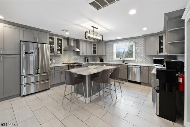 130 Decker Rd, Butler Boro, NJ 07405 - kitchen with stainless steel appliances, wall chimney exhaust hood, gray cabinets, decorative backsplash, and recessed lighting