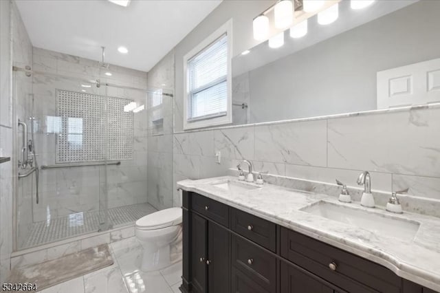 130 Decker Rd, Butler Boro, NJ 07405 - bathroom featuring a shower stall, toilet, double vanity, marble finish floors, and tile walls