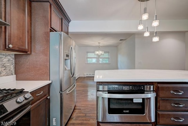 457 Central Ave, New Providence Boro, NJ 07974 - kitchen featuring stainless steel appliances, dark wood finished floors, light countertops, a chandelier, and pendant lighting
