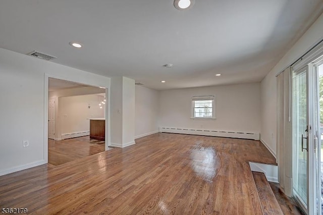 457 Central Ave, New Providence Boro, NJ 07974 - empty room featuring a baseboard radiator, wood finished floors, recessed lighting, and baseboards