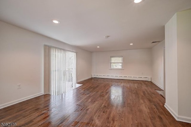 457 Central Ave, New Providence Boro, NJ 07974 - empty room featuring a baseboard heating unit, wood finished floors, baseboards, and recessed lighting
