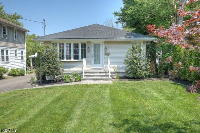 457 Central Ave, New Providence Boro, NJ 07974 - bungalow with a front lawn, entry steps, and a shingled roof