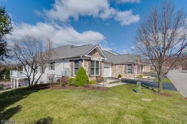 24 Quartz Way, Woodland Park, NJ 07424 - ranch-style home featuring stone siding, a garage, a front lawn, and driveway