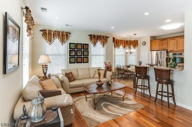 24 Quartz Way, Woodland Park, NJ 07424 - living area featuring a chandelier, light wood-type flooring, and recessed lighting