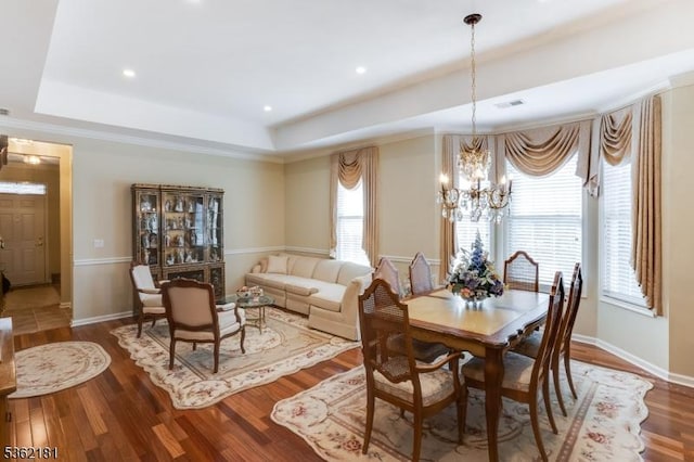 24 Quartz Way, Woodland Park, NJ 07424 - dining space featuring a chandelier, a raised ceiling, wood finished floors, and baseboards