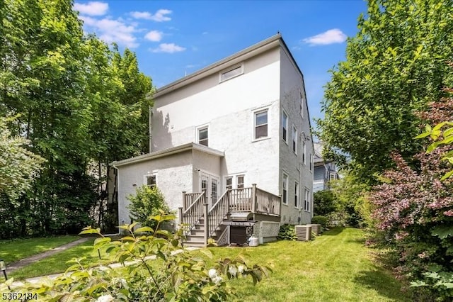 5 Canterbury Dr, Montclair Twp, NJ 07042 - rear view of house with stucco siding, central AC, a yard, a wooden deck, and stairs