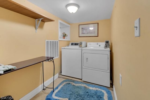 280 Highland Ave Unit 3, Kearny Town, NJ 07032 - laundry room with washer and clothes dryer and light tile patterned flooring