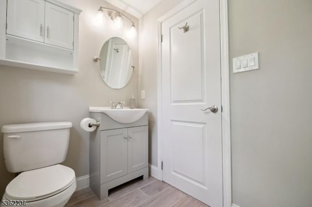 11 Western Blvd, Long Hill Twp, NJ 07933 - bathroom with vanity, baseboards, toilet, and wood finished floors
