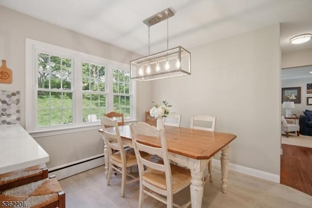 11 Western Blvd, Long Hill Twp, NJ 07933 - dining space featuring baseboard heating, light wood-style floors, and baseboards
