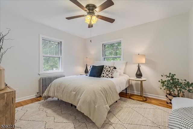 248 Knickerbocker Rd, Closter Boro, NJ 07624 - bedroom with radiator heating unit, light wood finished floors, baseboards, and ceiling fan