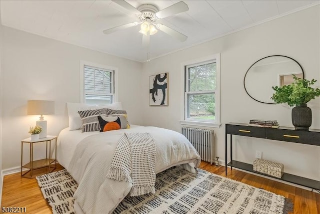 248 Knickerbocker Rd, Closter Boro, NJ 07624 - bedroom with radiator heating unit, wood finished floors, baseboards, a ceiling fan, and ornamental molding