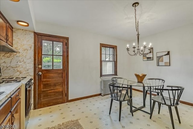 248 Knickerbocker Rd, Closter Boro, NJ 07624 - dining space with plenty of natural light, a chandelier, radiator, and baseboards