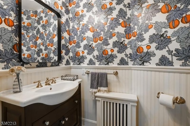 89 Maple St, Millburn Twp, NJ 07041 - bathroom with wallpapered walls, a wainscoted wall, and vanity