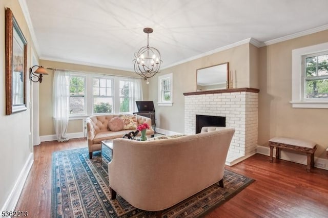 89 Maple St, Millburn Twp, NJ 07041 - living room featuring wood finished floors, a chandelier, baseboards, ornamental molding, and a fireplace