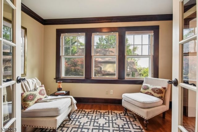 89 Maple St, Millburn Twp, NJ 07041 - living area with crown molding, healthy amount of natural light, wood finished floors, and baseboards