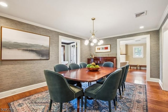 89 Maple St, Millburn Twp, NJ 07041 - dining area featuring baseboards, wood finished floors, a chandelier, crown molding, and recessed lighting