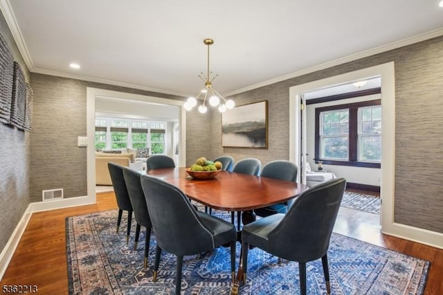89 Maple St, Millburn Twp, NJ 07041 - dining room with baseboards, a chandelier, wood finished floors, ornamental molding, and wallpapered walls