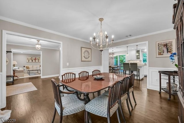 48 Kahdena Rd, Morris Twp, NJ 07960 - dining area featuring a chandelier, dark wood-style flooring, wainscoting, a decorative wall, and crown molding