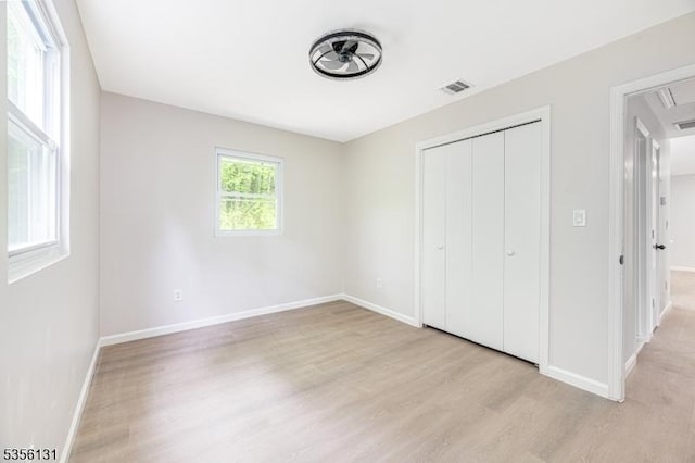 10 Maple Dr, Vernon Twp, NJ 07461 - unfurnished bedroom featuring light wood-style flooring, attic access, baseboards, and a closet