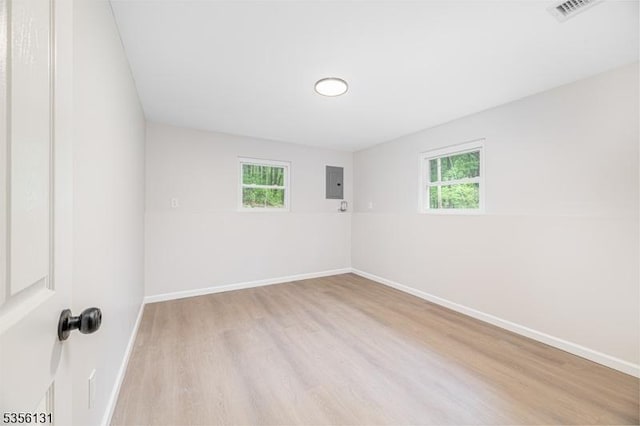 10 Maple Dr, Vernon Twp, NJ 07461 - empty room featuring electric panel, wood finished floors, and baseboards