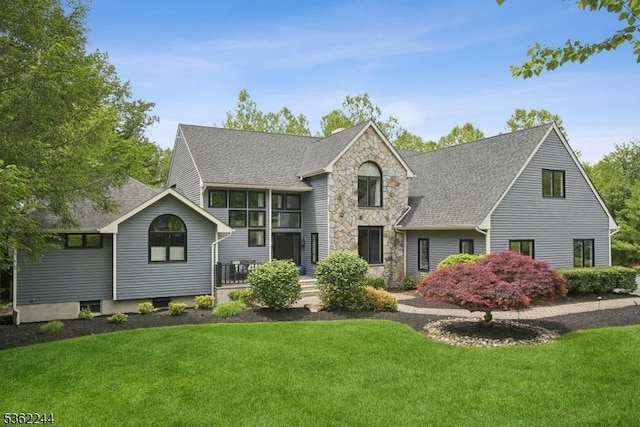 25 Hook Mountain Dr, Clinton Twp, NJ 08801 - view of front facade with stone siding, a front lawn, and a shingled roof