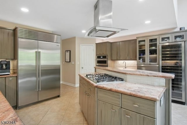 25 Hook Mountain Dr, Clinton Twp, NJ 08801 - kitchen with stainless steel appliances, island range hood, wine cooler, decorative backsplash, and baseboards