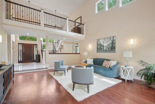 25 Hook Mountain Dr, Clinton Twp, NJ 08801 - living room featuring stairway, wood finished floors, baseboards, and a towering ceiling