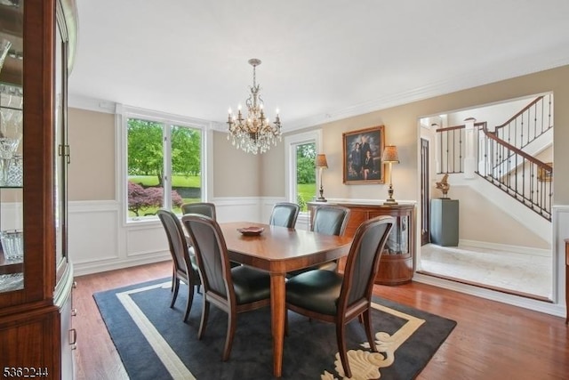 25 Hook Mountain Dr, Clinton Twp, NJ 08801 - dining space featuring a chandelier, wood finished floors, a wainscoted wall, and stairs