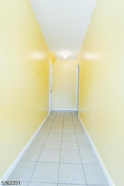 513 Maple Ave, Elizabeth City, NJ 07202 - hallway with light tile patterned floors and baseboards