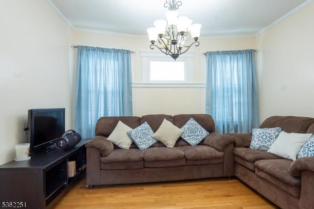 513 Maple Ave, Elizabeth City, NJ 07202 - living area featuring a chandelier, crown molding, and light wood-style flooring