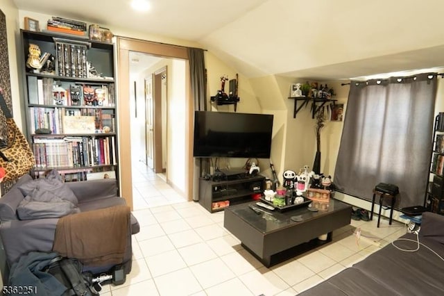 513 Maple Ave, Elizabeth City, NJ 07202 - living room featuring light tile patterned flooring, vaulted ceiling, and a baseboard radiator