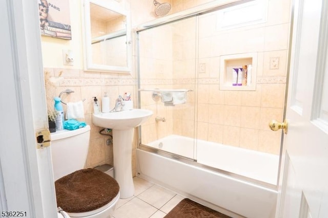 513 Maple Ave, Elizabeth City, NJ 07202 - full bathroom featuring toilet, tile walls, tile patterned floors, enclosed tub / shower combo, and a sink