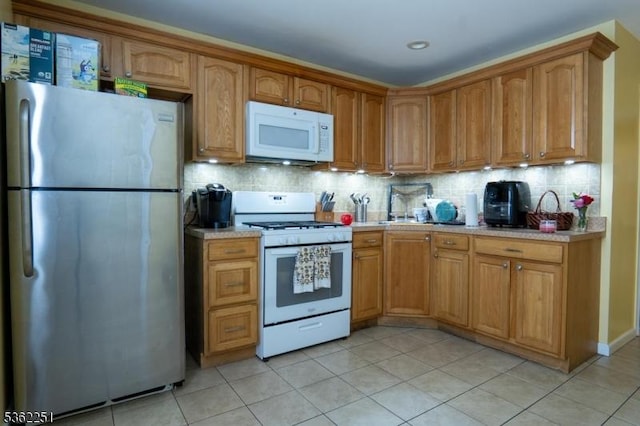 513 Maple Ave, Elizabeth City, NJ 07202 - kitchen featuring white appliances, light countertops, and light tile patterned flooring