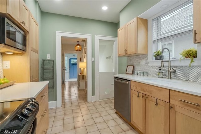 179 W Fairview Ave, South Orange Village Twp, NJ 07079 - kitchen with stainless steel appliances, light brown cabinets, decorative backsplash, light tile patterned floors, and light countertops