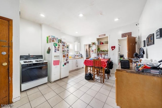 639 N 8th St, Newark City, NJ 07107 - kitchen featuring white appliances, white cabinetry, light tile patterned flooring, recessed lighting, and open shelves