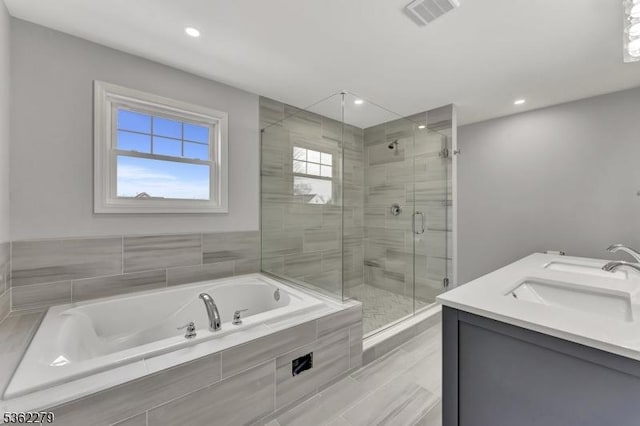 28 Kenmore Rd, Edison Twp, NJ 08817 - full bathroom with a garden tub, a shower stall, recessed lighting, and double vanity