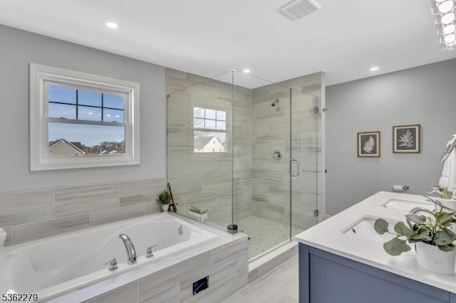 28 Kenmore Rd, Edison Twp, NJ 08817 - bathroom featuring a garden tub, a shower stall, double vanity, and recessed lighting