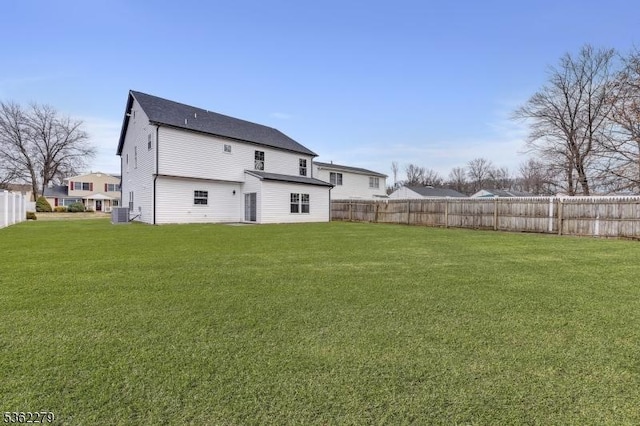 28 Kenmore Rd, Edison Twp, NJ 08817 - back of property featuring central air condition unit and roof with shingles