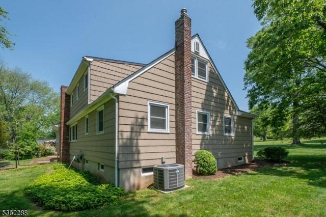 1666 Valley View Rd, Bridgewater Twp, NJ 08836 - view of property exterior featuring central AC unit, a yard, and a chimney