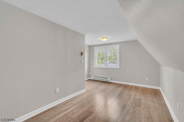 10 Rutgers Way, Hopatcong Boro, NJ 07843 - bonus room with baseboard heating, wood finished floors, vaulted ceiling, and baseboards
